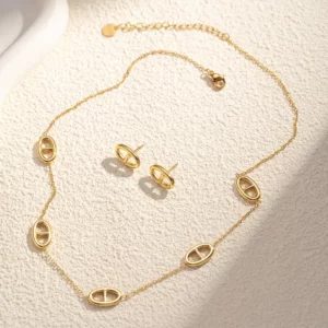 parure collier boucle d'oreille motif ovale